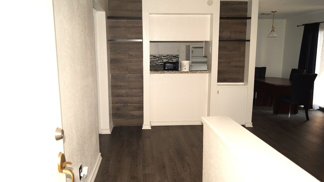 Building Photo - End Unit with Strip Views