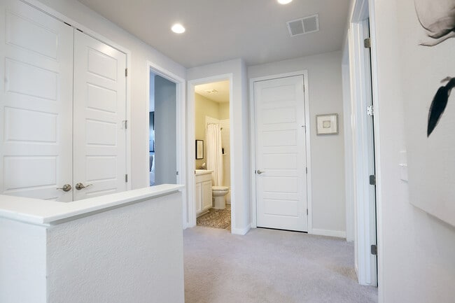Upper landing with expansive linen closet and laundry closet. - 15637 E Broncos Pl