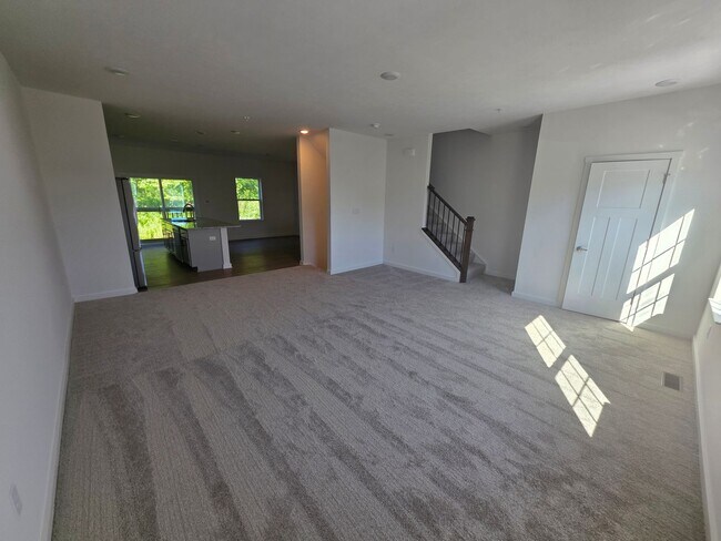 Building Photo - Brand-new townhome with modern finishes, flexible living space, and low-maintenance living.