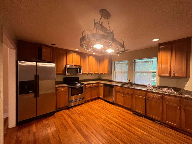 Building Photo - Massive 3 Bedroom 2.5 Bathroom Single-Family Home with Real Hardwood Floors and a Huge Two-Car Ga...