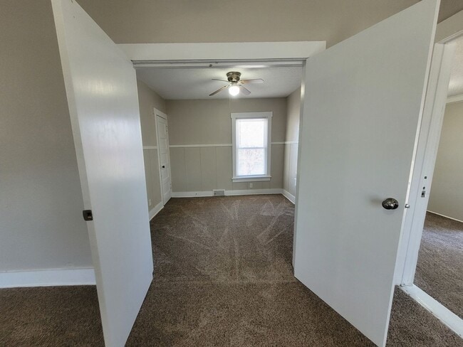 Building Photo - Four bedroom home on Indianola Ave with large yard and two decks!