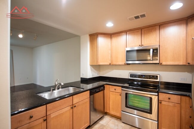Building Photo - Charming 1 Bedroom/1 Bath Condo with Private Backyard & Double Parking Spaces