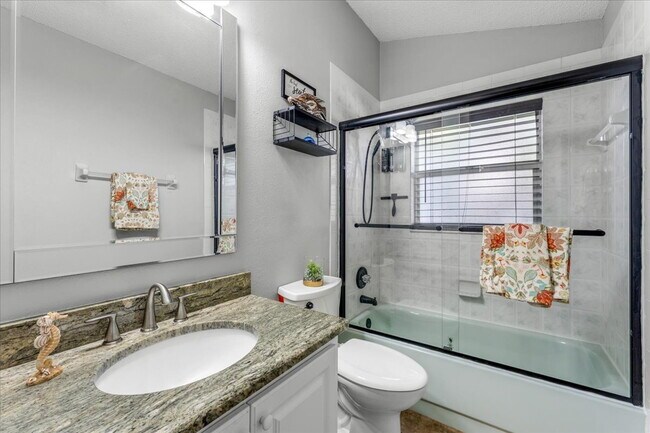 Building Photo - A vibrant 2-bedroom, 2-bathroom tropical retreat designed for both high-energy entertaining and l...