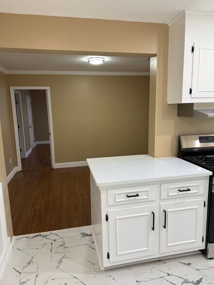 Shared White Quartz Counter connects with Dining Room - 18 Waters Ave