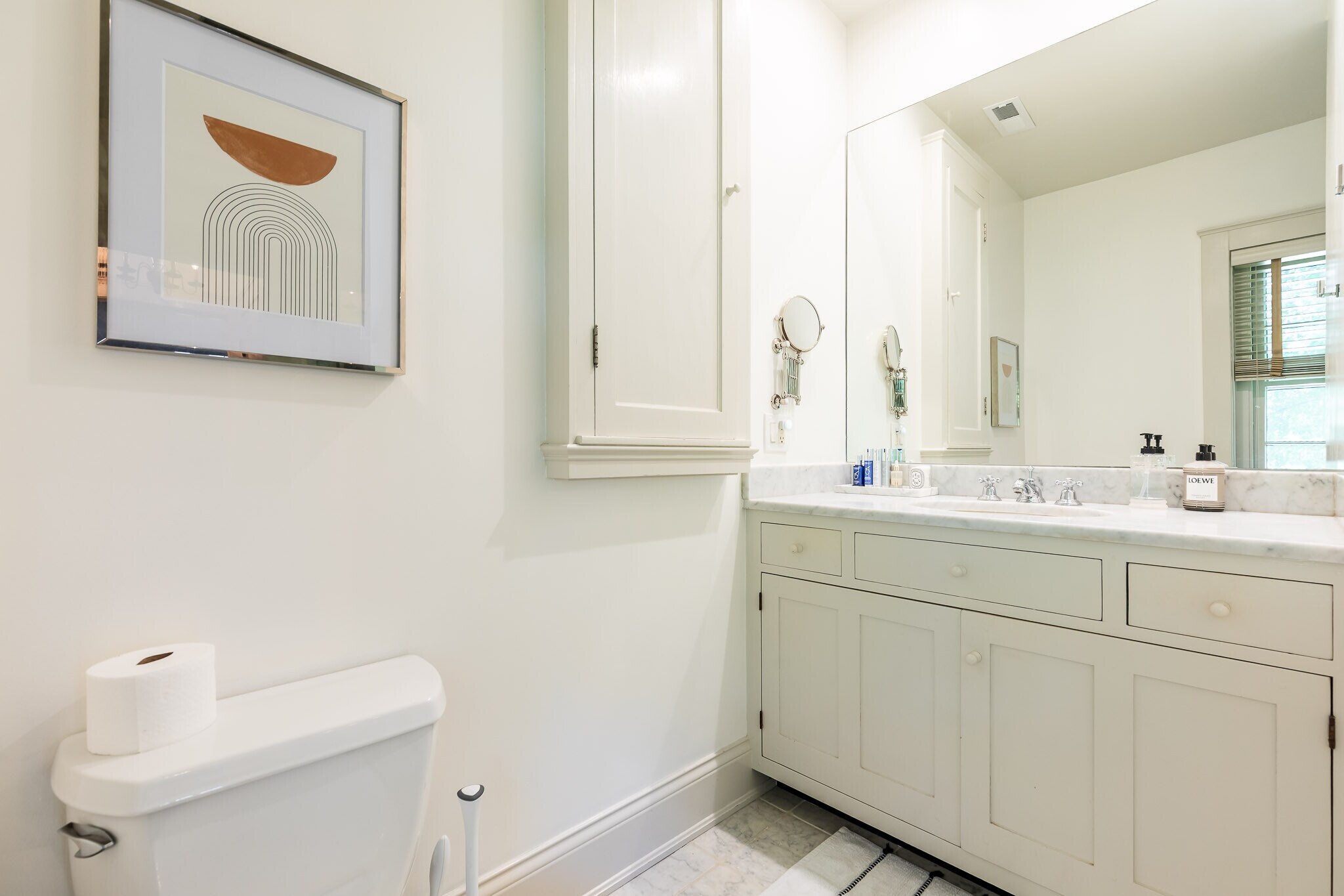 Custom cabinetry with large medicine cabinet. - 4061 Beechwood Ave