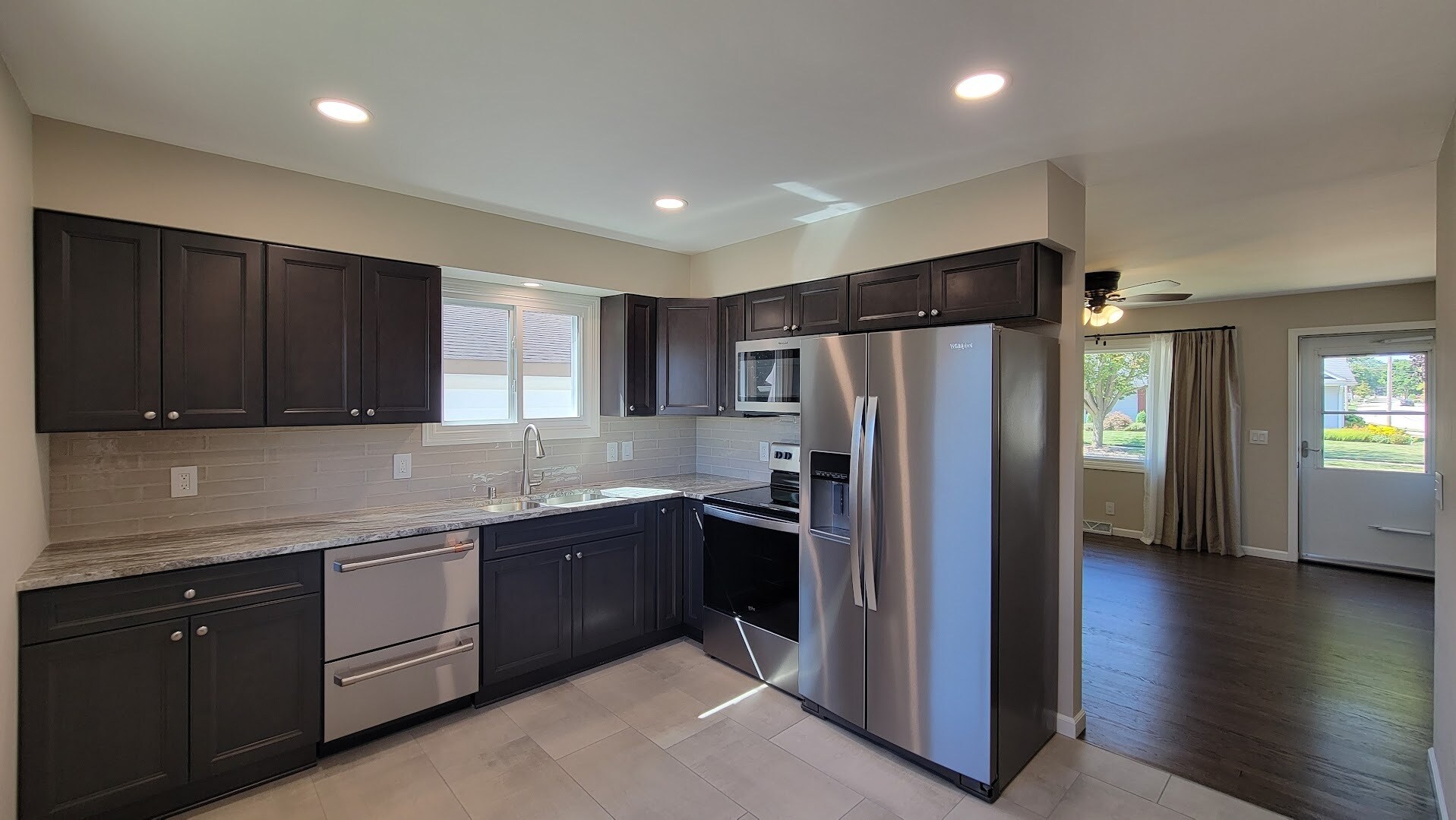 New Kitchen Cabinets and quartzite countertops. New stainless appliances. New Tile and backsplash. - 6305 49th Ave