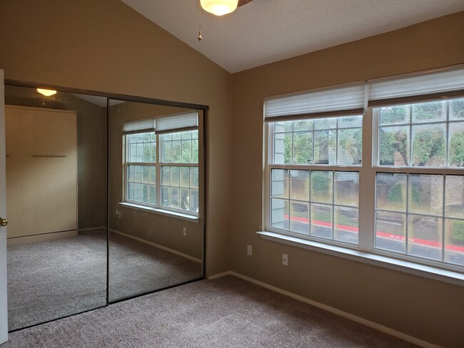 2nd bedroom has built in Murphy bed & large windows. - 7122 Wood Hollow Dr