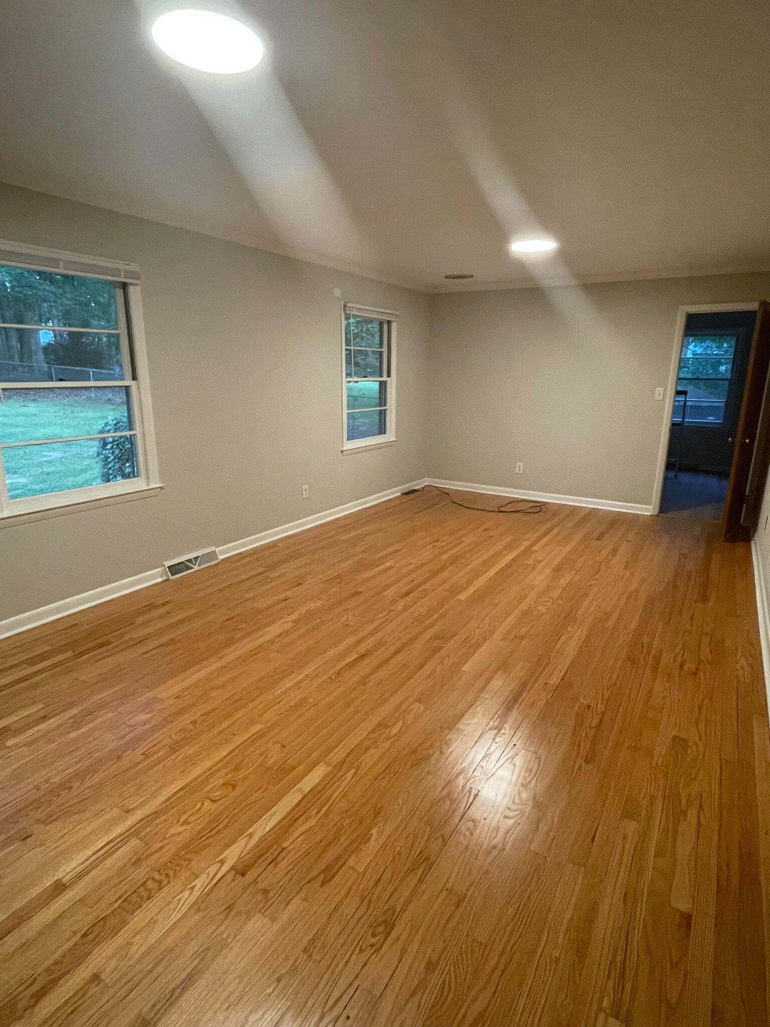 Den with view of backyard and refinished hardwoods - 2112 Kilburn Rd