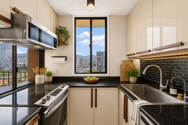 Building Photo - Wake Up to Stunning Mountain & Ala Wai Canal Views in the Heart of Waikiki