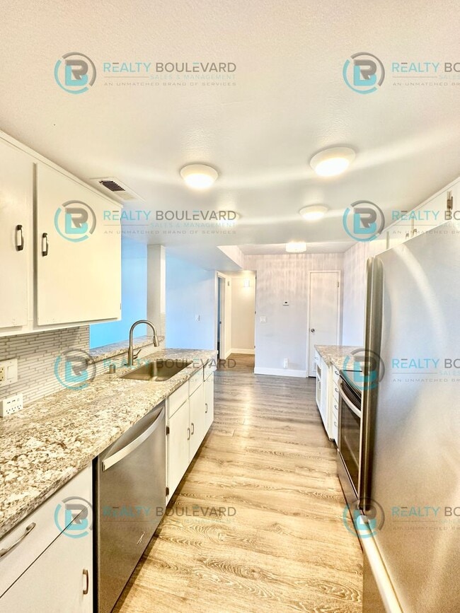 Building Photo - Indulge in comfortable living at Wood Chase Condos!