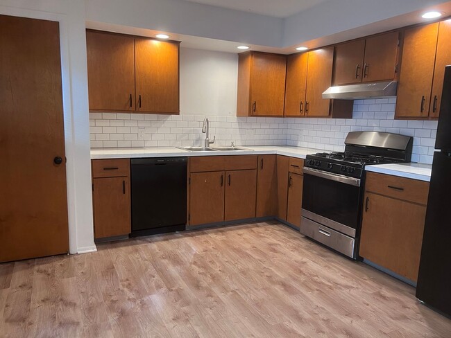 Building Photo - Two Bedroom Duplex SE Side w/ Decorative Fireplace! One Stall in Garage!