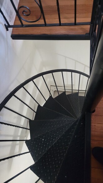 Spiral stairs to lower level - 881 Broadway