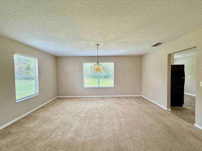 Building Photo - LARGE AND SPACIOUS 4/3 HOME IN EAST ORLANDO WEDGEFIED COMMUNITY