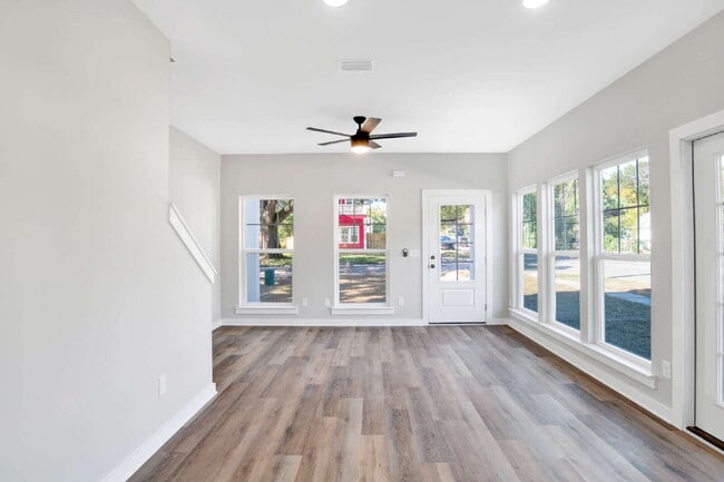 Building Photo - **Available now. This pet-friendly property features a small fenced yard with water and lawn main...