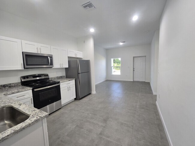 Building Photo - Brand-New 2/2/1 -SW Lehigh Acres-See this ...