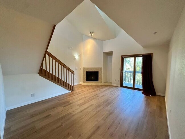 Building Photo - Stylish 3rd Level, Private 2 bedroom Apartment With LVP Flooring, Decks, Gas Fireplace & In-Unit ...