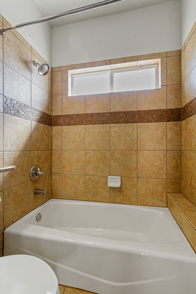 Building Photo - "Spacious 4-Bed Oasis with Granite Touches...
