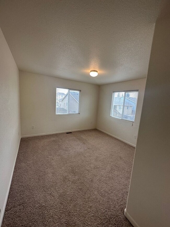 Building Photo - 3 BEDROOM, 2.5 BATHROOM TWINHOME WITH 2 CAR ATTACHED GARAGE