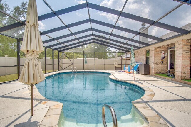 Building Photo - Milton 4BR Pool Home with Office, Vaulted Ceilings, Screened Saltwater Pool & 2-Car Garage
