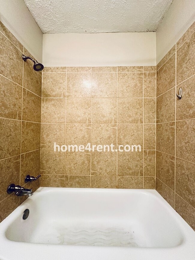 Building Photo - Attractive Prairie Village Ranch w/ FRESH PAINT, Wood Floors, Granite Counters and a Fenced Yard!