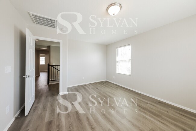 Building Photo - This home exudes a cheerful and welcoming charm!