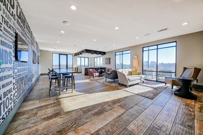 Our rooftop lounge features ample seating and a fire pit. - Windsor Fitzhugh