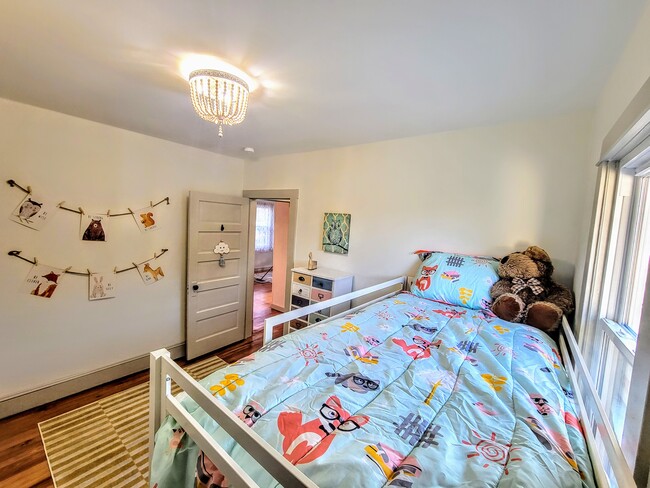 Second bedroom with large wall of closet space - 112 Anderson Ave