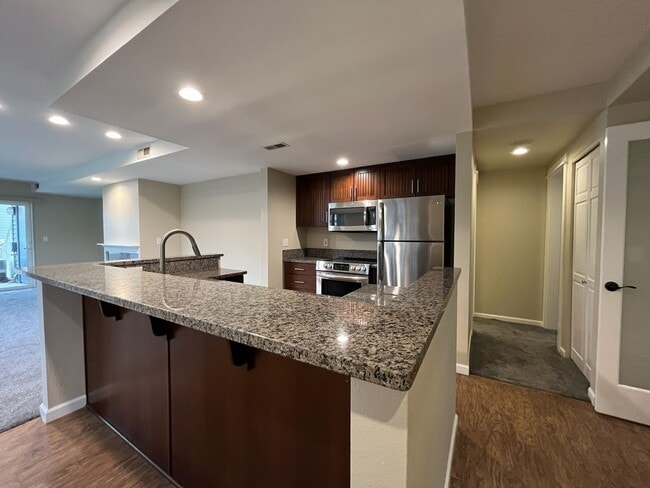 Building Photo - Ground Floor End Unit on Jantzen Beach with River Views & Flexible Living Space