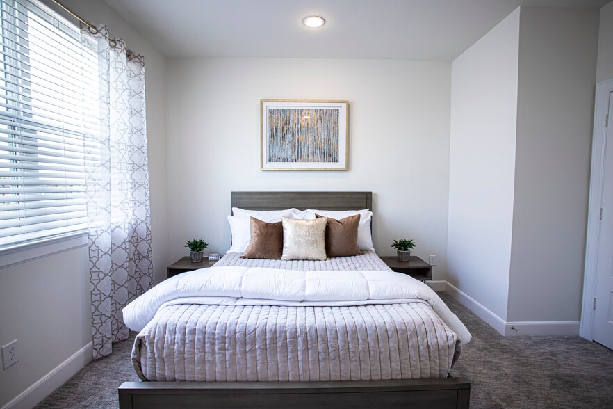 Bedroom two is simple yet modern. - 2713 Eado Edge Ct