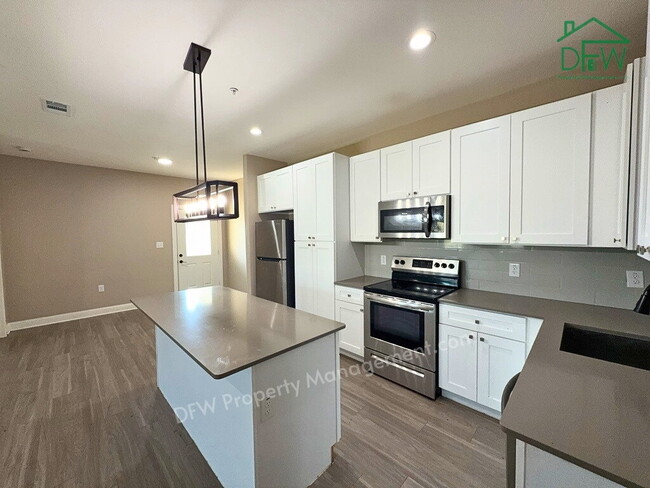 Building Photo - Spacious 4-Bedroom Corner Home - 2-Car Garage, Fenced Yard
