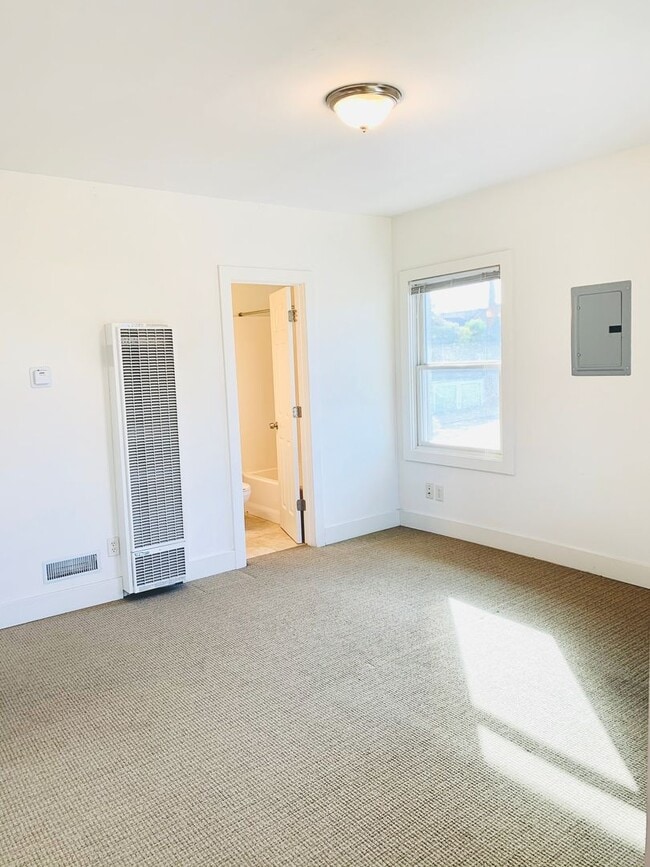 Building Photo - STUDIO WITH A PEAK VIEW OF DOWNTOWN! $1,49...