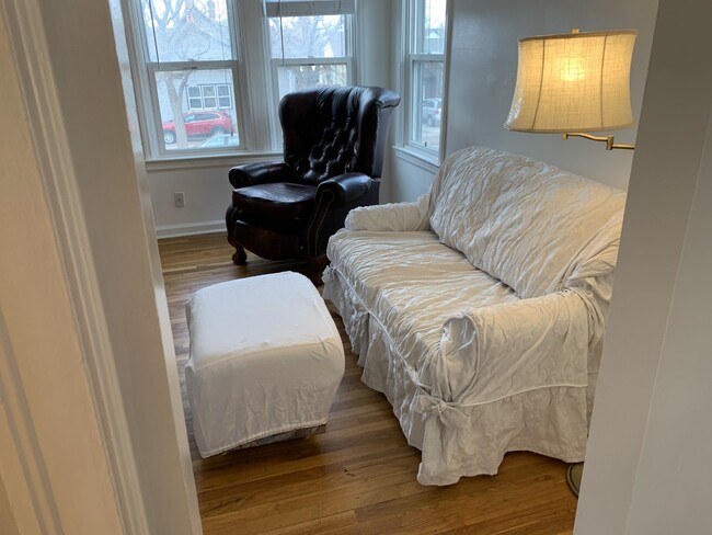 Cozy couch, ottoman, and leather reclining chair - 1910 Evans Ave