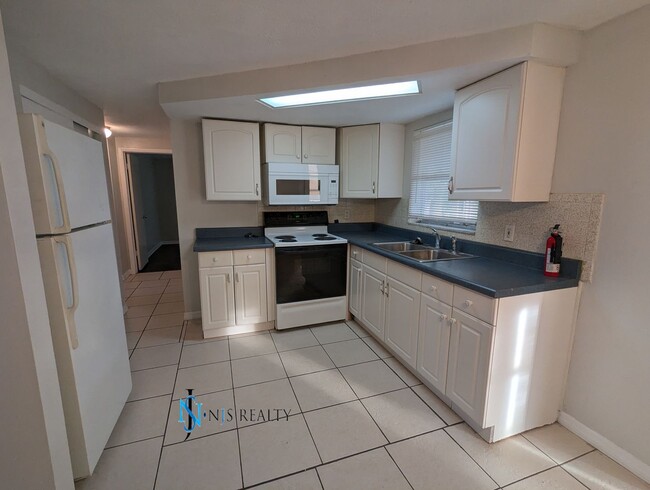 Building Photo - 2/1.5/1 1050 Sq. Ft. home with a FIREPLACE...