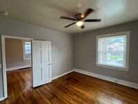 Building Photo - "Charming 2-Bedroom Retreat with Wood Floors with Basement!"