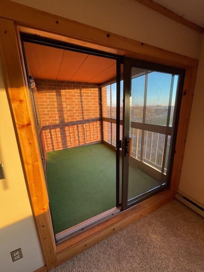 Sunroom, three season porch connected to living room with great views of Louisiana Oaks Park - 3320 Louisiana Ave S