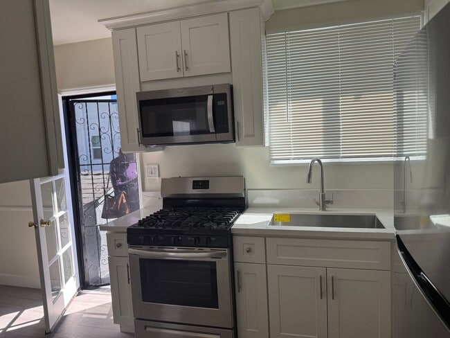 Building Photo - FOR RENT — COMPLETELY REMODELED Apartment