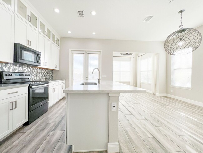 Building Photo - Luxury 4-Bedroom Townhome in Laureate Park – Now Available!