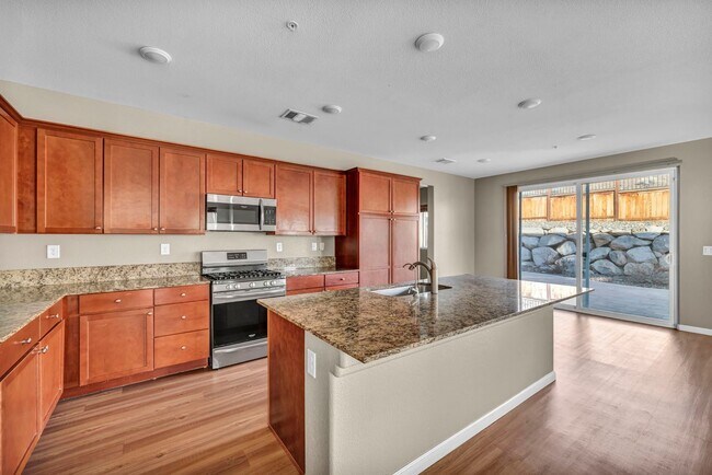 Building Photo - Sun-Filled, Spacious Living with a Three-Car Garage