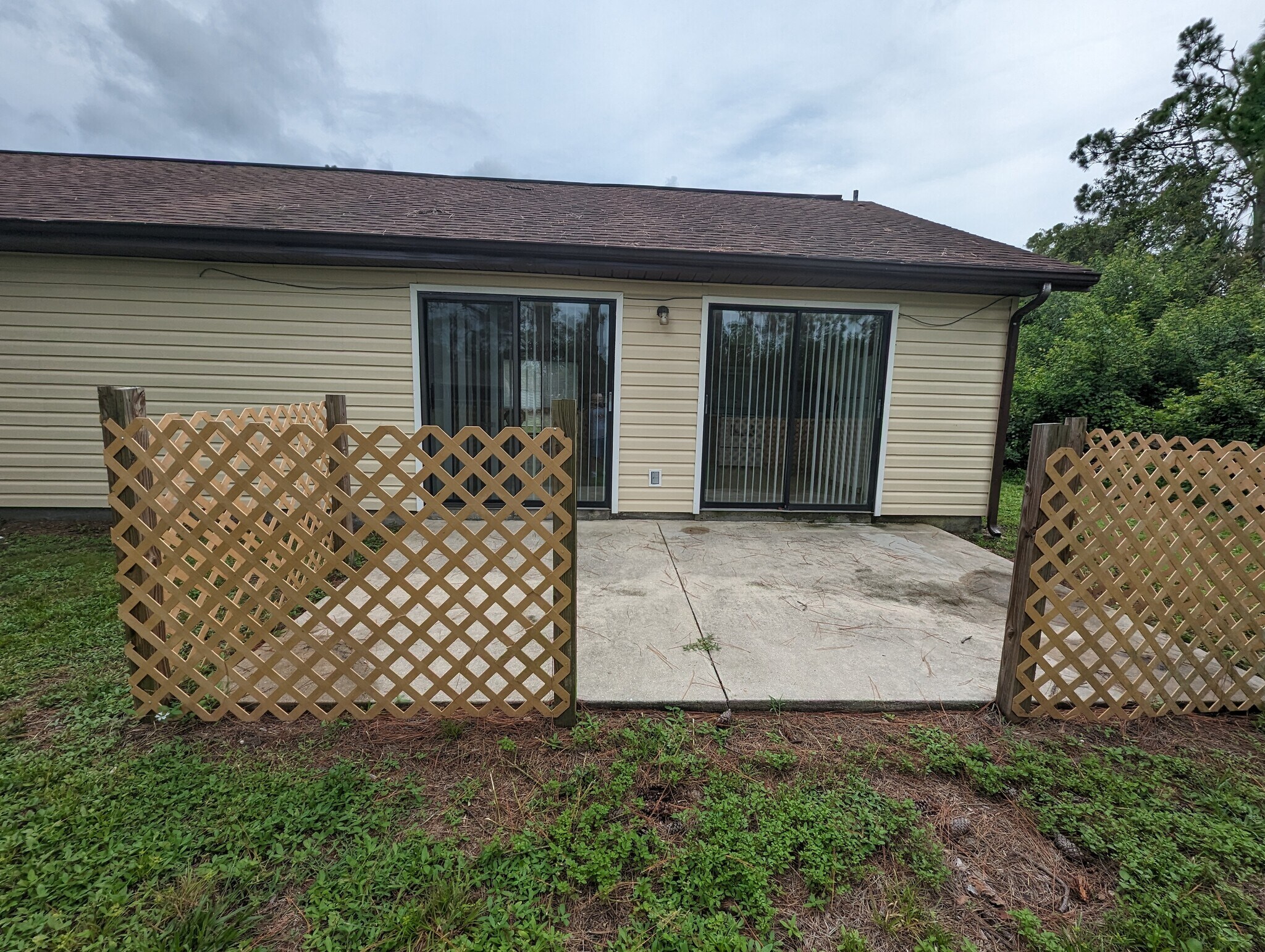 Back of house-Great room & Kitchen sliders - 3740 Giblin Dr