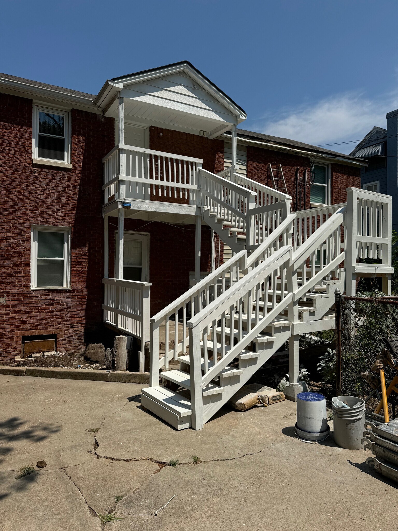 Back porch and stairs down to shared parking lot - 2223 N Gatewood Ave