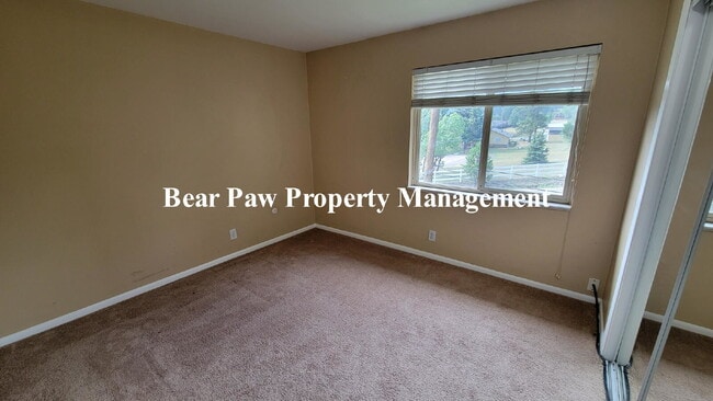 Building Photo - "Charming 2-Bed Condo with Cozy Fireplace in Scenic Evergreen!"