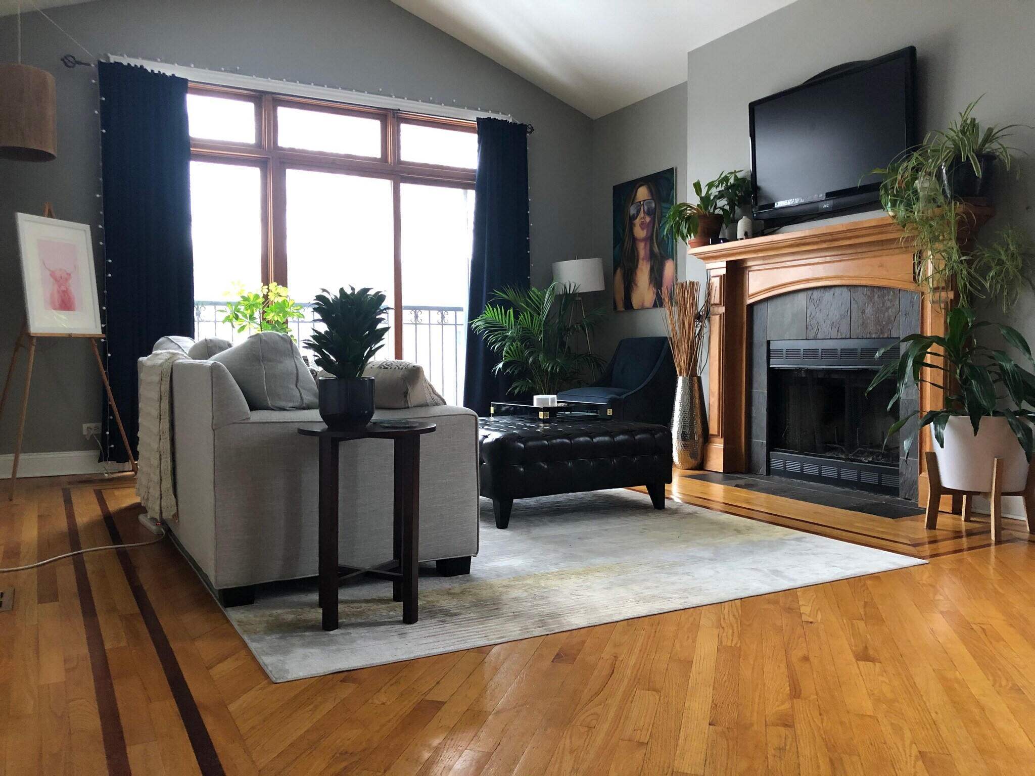 Living room with furniture. Sliding doors overlook street. - 4933 N Winthrop Ave
