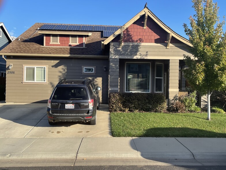 Driveway parking, entry at left - 2986 E Eaton Rd