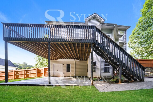 Building Photo - Welcome to this charming abode.