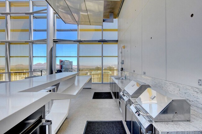 Building Photo - Stunning Strip Views from this Fully Furnished Studio Residence.