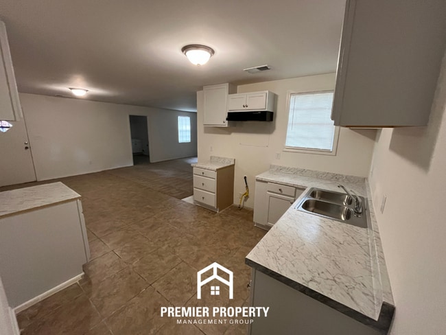 Building Photo - Spacious 3BR/2BA Home with Den & Living Room | Brick Fireplace & Large Yard