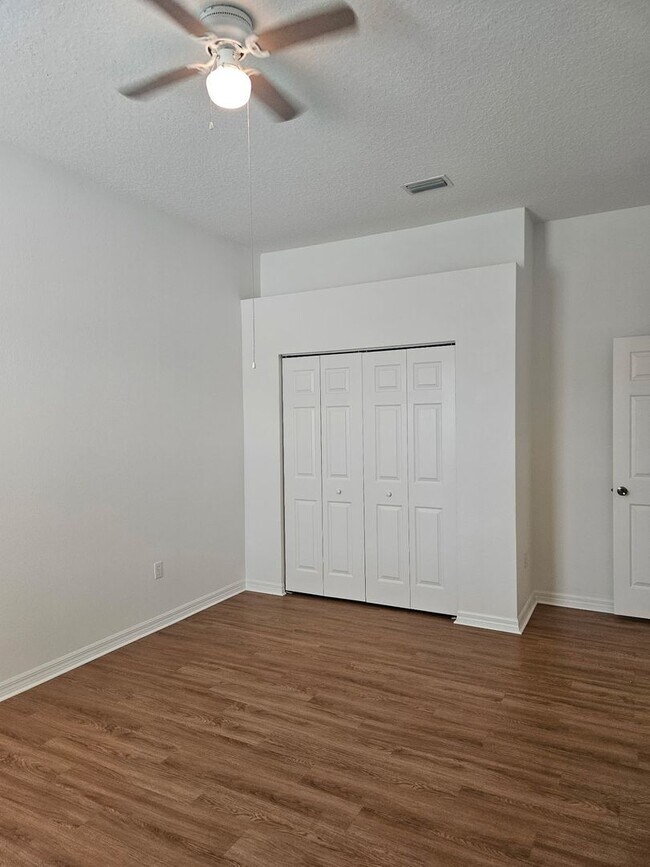 Building Photo - 4 BEDROOM 3 FULL BATH HOME WITH A SCREENED IN POOL IN THE BEAUTIFUL PALM COAST