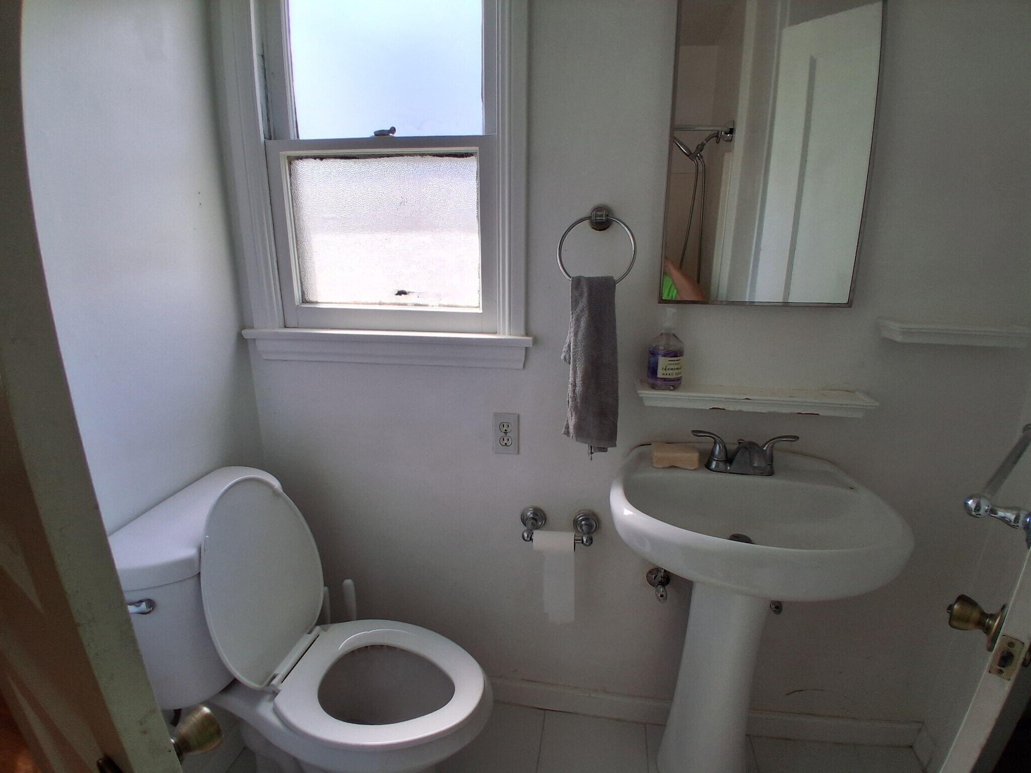 bathroom with window - 902 Patterson Ave