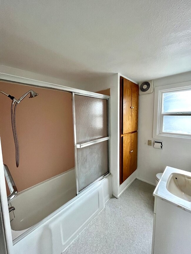 Building Photo - Cozy Single family home with two car garage and controlled access gate