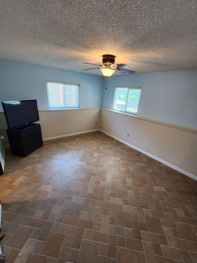 Building Photo - Spacious 4-Bedroom Home with RV Parking in...